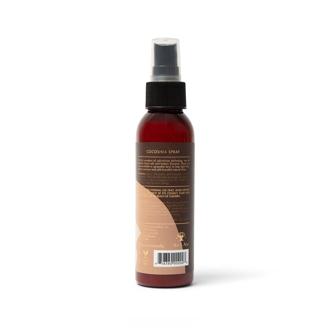 Back of a brown spray bottle with a white label. The bottle contains As I Am Classic CocoShea Spray. The label shows product information such as ingredients, instructions for use and warnings.