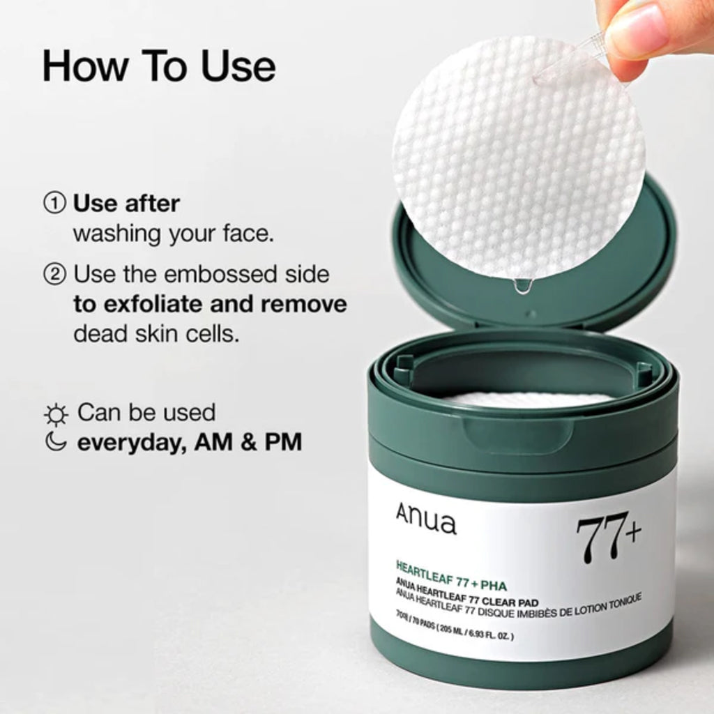Anua Heartleaf 77 Clear Pad in open green container with cotton pad lifted over, ready to exfoliate the skin.