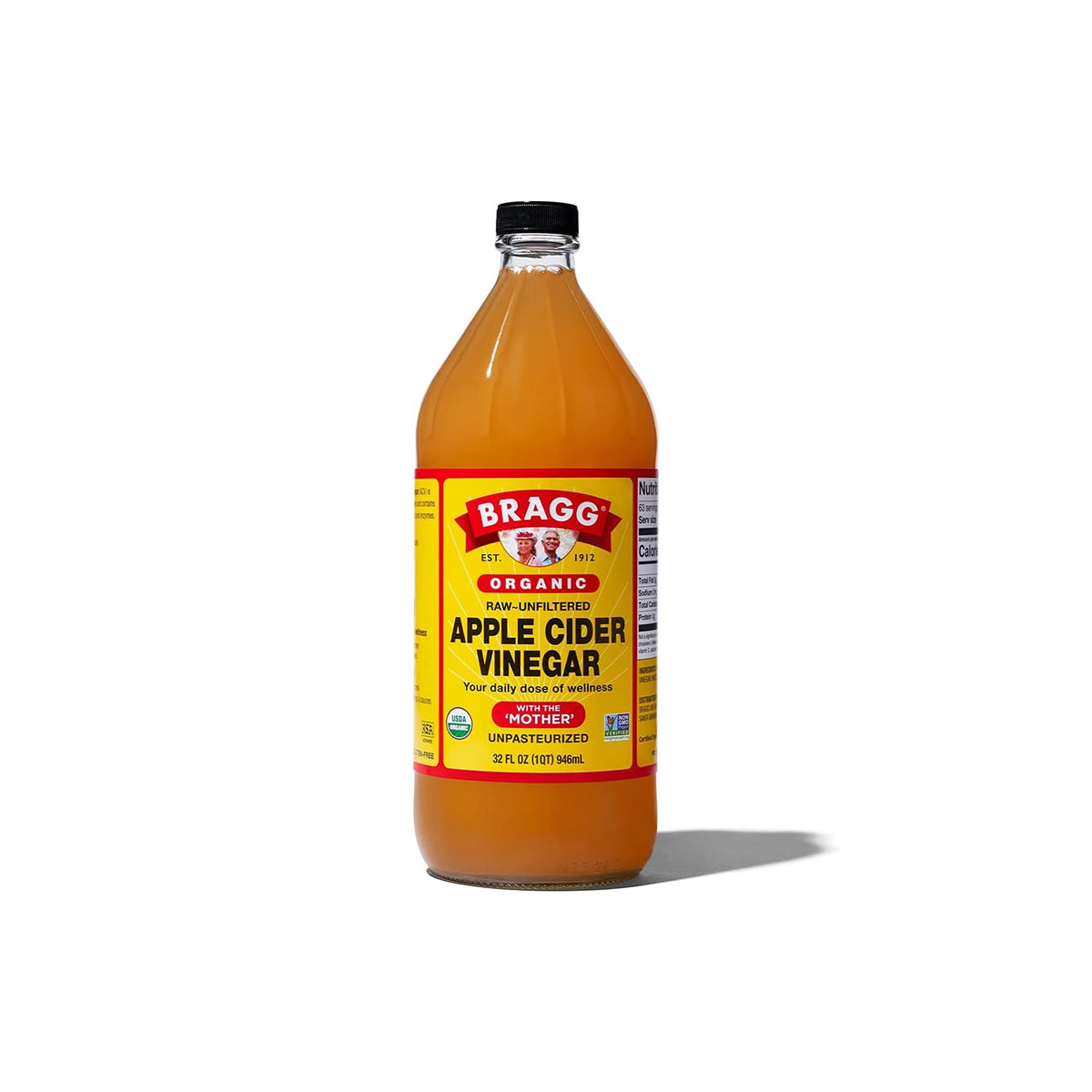 Bragg Organic Apple Cider Vinegar 946 ml in transparent glass bottle with yellow and red label, unfiltered and unpasteurized with 'The Mother'.