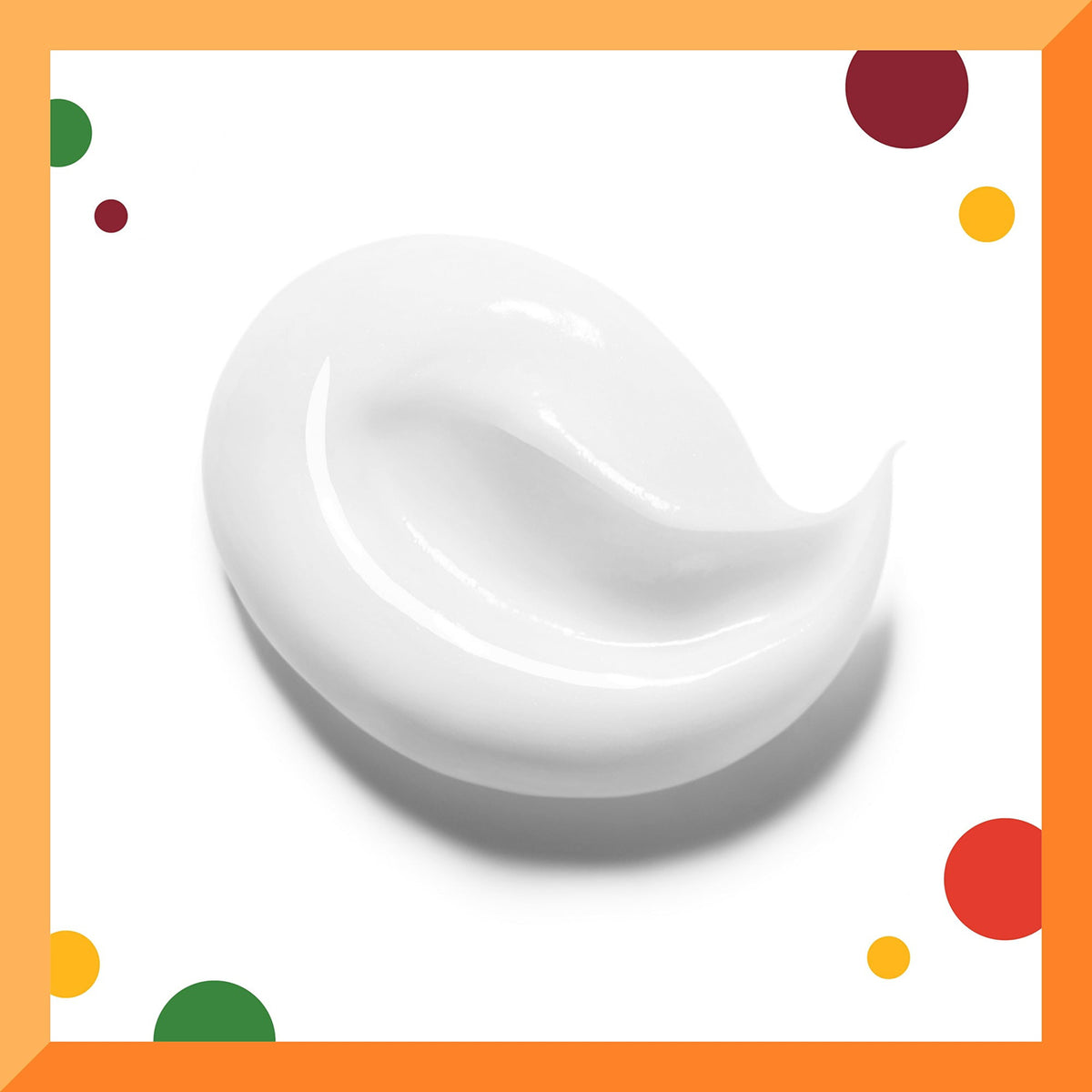 A white, creamy blob of Cantu For Kids Nourishing Conditioner on a white background with an orange frame and colored circles in the corners.