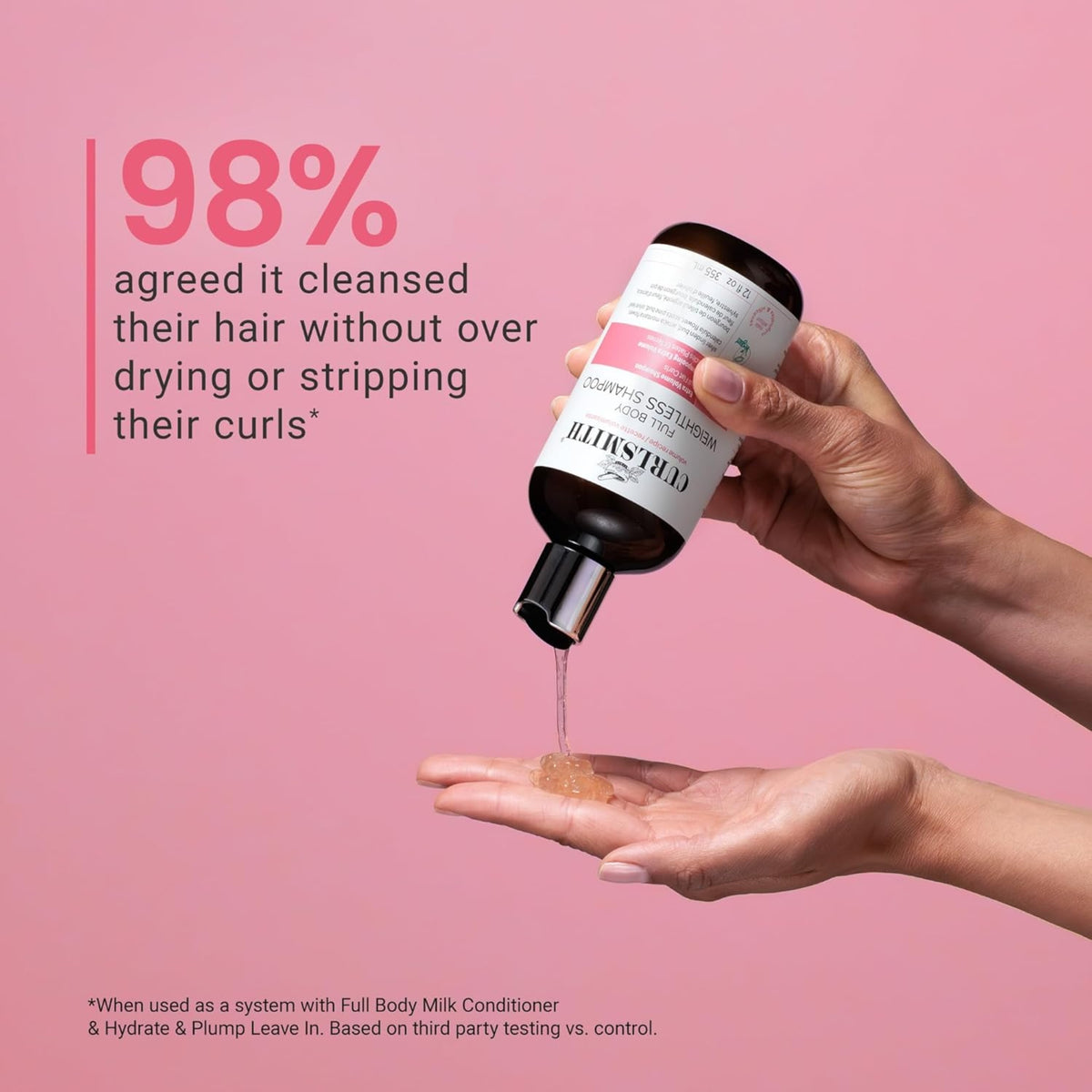 Curlsmith Weightless Shampoo is poured into the hand on a pink background, 98% cleans the hair without drying out.