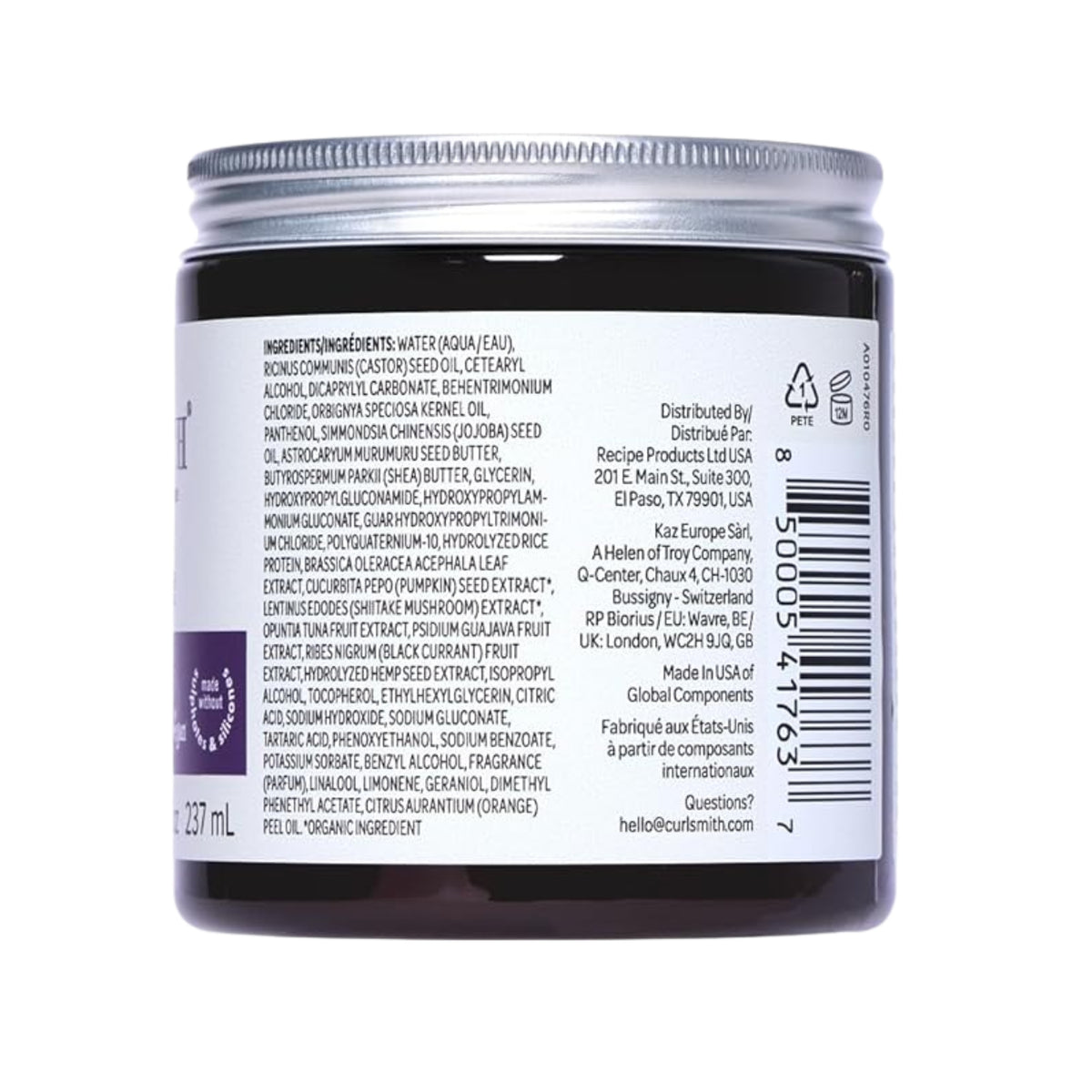 Curlsmith hair product in dark glass jar with silver lid, ingredient list visible on the white label.