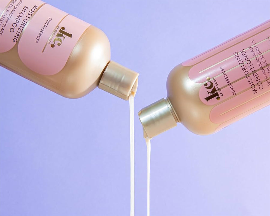 Keracare Curlessence Moisturizing Shampoo and Moisturizing Conditioner are poured against a purple background.