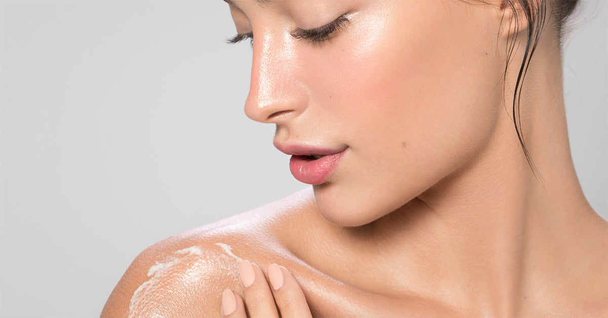 Image of women using palmers cocoa butter formula fragrance free moisturizing lotion 400ml.