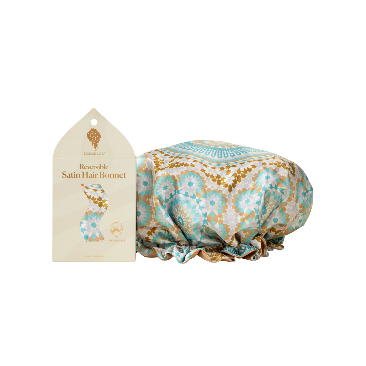 Bounce Curl Reversible Satin Hair Bonnet with oriental pattern in blue, gold and white next to elegant packaging.
